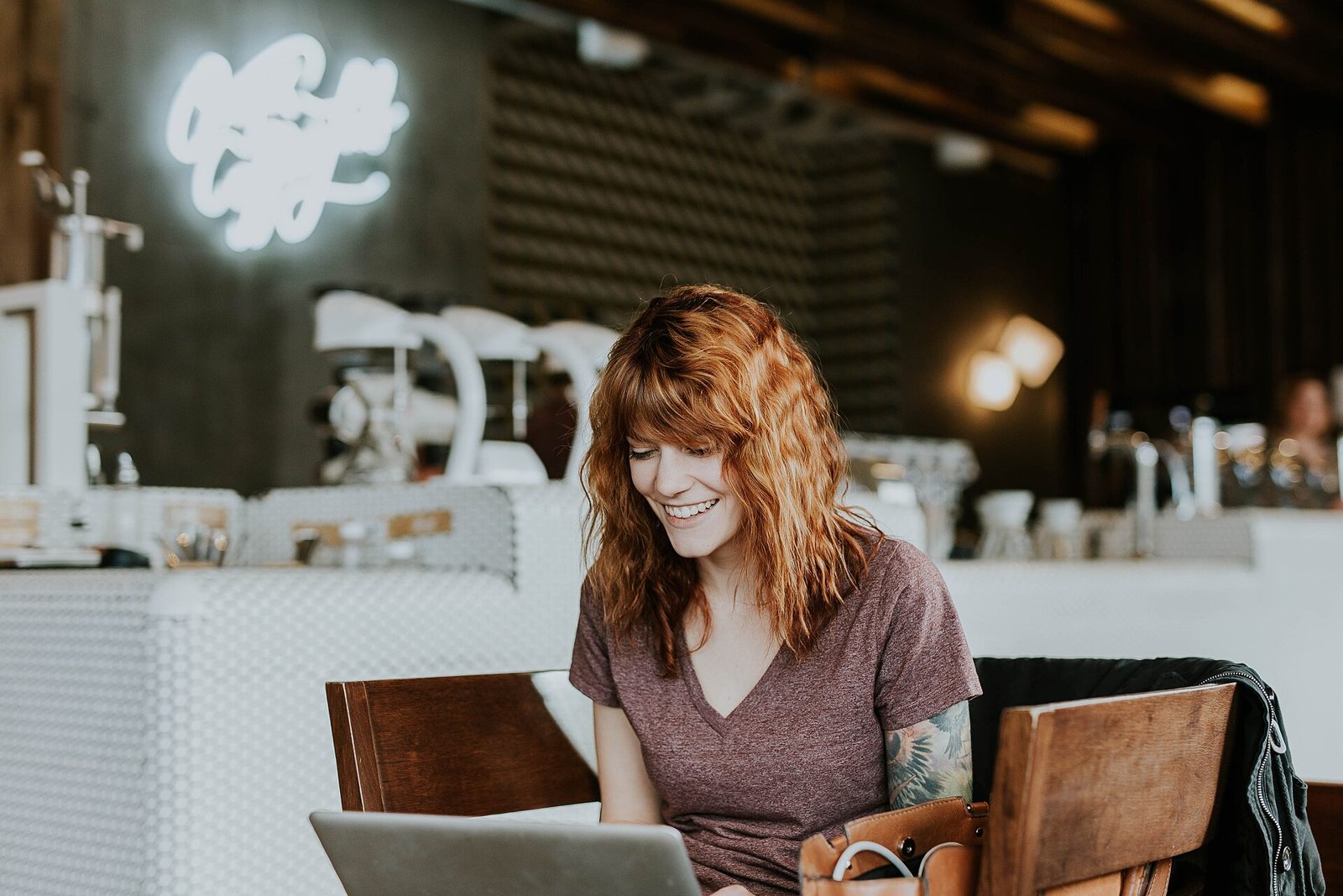 A person using a laptop in a relaxed workspace